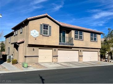 Two-story townhome with three-car garage and balcony at 6255 W Arby Ave # 370, Las Vegas, NV 89118