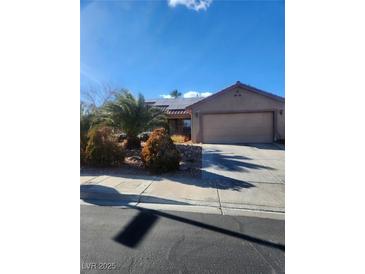 One-story house with solar panels and a two-car garage at 1021 Amber Gate St, Henderson, NV 89002