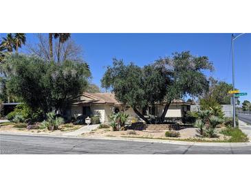 Single-story house with mature landscaping and a large tree in the front yard at 2310 Laurie Dr, Las Vegas, NV 89102