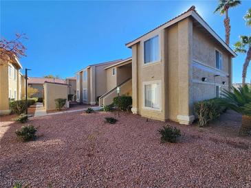 Two story condo building with landscaping and walkway at 7200 Pirates Cove Rd # 2005, Las Vegas, NV 89145