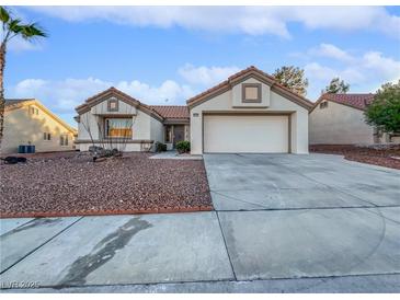 Single-story house with a two-car garage and desert landscaping at 8509 Goodhaven Dr, Las Vegas, NV 89134