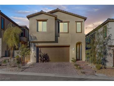 Two-story house with brown garage door and brick pavers at 11560 Observation Point Ave, Las Vegas, NV 89138