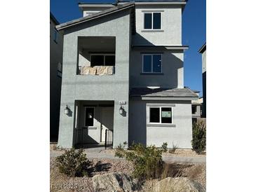 Two-story house with gray siding, and a small front yard at 4761 Parkarbor Ave, Las Vegas, NV 89141