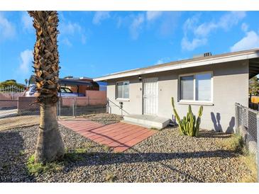 Single story house with a front yard, walkway, and desert landscaping at 1641 Stewart Ave, Las Vegas, NV 89101