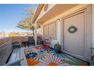 Inviting patio with colorful rug, wrought iron furniture, and bench at 2050 N Los Feliz St # 172, Las Vegas, NV 89156