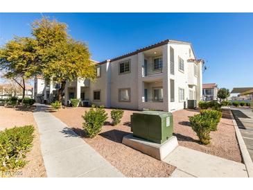 Two-story condo building with landscaped grounds and walkways at 3318 N Decatur Blvd # 2138, Las Vegas, NV 89130