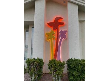 Building exterior with illuminated palm tree design at 3550 Bay Sands Dr # 2062, Laughlin, NV 89029