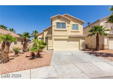 Two-story house with attached garage and desert landscaping at 3728 Shallow Dove Ct, North Las Vegas, NV 89032