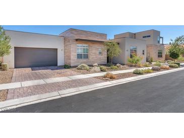 Stunning modern home with stone accents and landscaped front yard at 4308 Sunrise Flats St, Las Vegas, NV 89135