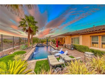 Stunning pool and spa with lounge chairs, creating a relaxing outdoor space at 70 Portezza Dr, Henderson, NV 89011