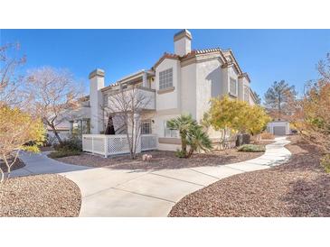 Spanish style condo with walkway and landscaping at 1690 Normandy Way # 824, Henderson, NV 89014