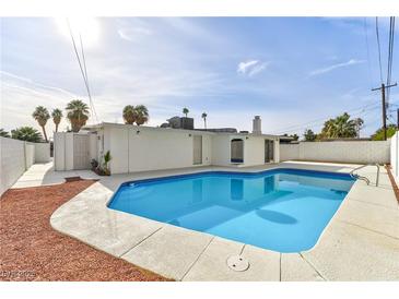 Inviting backyard pool with ample surrounding patio space at 3108 Emmons St, North Las Vegas, NV 89030