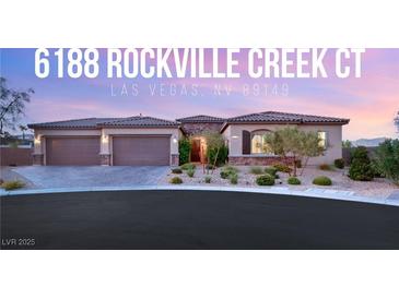 Single-story home with three-car garage and landscaped front yard at 6188 Rockville Creek Ct, Las Vegas, NV 89149