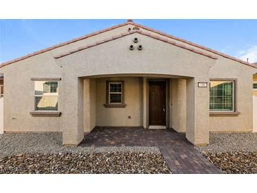 Single-story home with a covered porch and brick walkway at 746 Chopin Hills St, Henderson, NV 89011