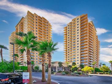 Two modern high-rise buildings with palm trees and a clear sky at 8255 Las Vegas Blvd # 619, Las Vegas, NV 89123