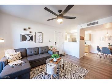 Spacious living room with sectional sofa and modern decor at 950 Seven Hills Dr # 2017, Henderson, NV 89052