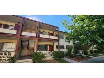 Two-story building with balconies and a well-maintained exterior at 350 E Desert Inn Rd # 202, Las Vegas, NV 89109