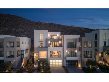 Modern three-story home with city views and attached garage at 410 Tranquil Peak Ct, Henderson, NV 89012