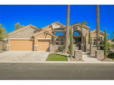 Stunning desert home with stone accents and a three-car garage at 6706 Pyracantha Glen Ct, Las Vegas, NV 89131