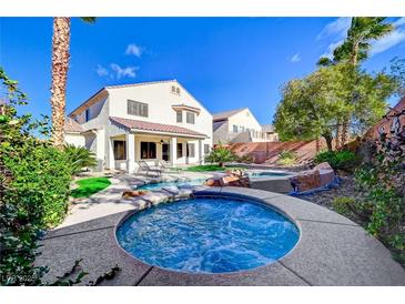 Inviting backyard with sparkling pool, spa, and ample lounge space at 3733 Via Di Girolamo Ave, Henderson, NV 89052