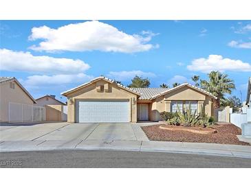 Single-story house with a two-car garage and well-maintained landscaping at 4318 Cobblehill Way, North Las Vegas, NV 89032