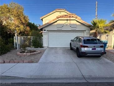 Two-story house with attached garage and landscaped front yard at 508 Sarajane Ln, Las Vegas, NV 89107