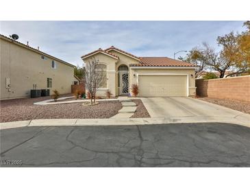 Single-story house with a two-car garage and landscaped front yard at , Las Vegas, NV 89148