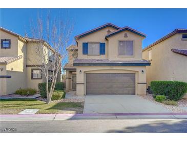 Charming two-story home with a well-manicured lawn, inviting curb appeal, and an attached two-car garage at 5648 Ancient Agora St, North Las Vegas, NV 89031