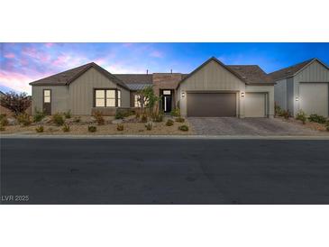 Craftsman style home with two-car garage and landscaped front yard at 8838 Sorrel Hills Ct, Las Vegas, NV 89113
