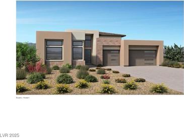 Modern home with two-car garage and desert landscaping at 157 Tre Pietre St, Henderson, NV 89011