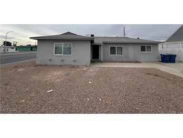 Gray single-story house with a gravel front yard and street view at 2036 Canosa Ave, Las Vegas, NV 89104