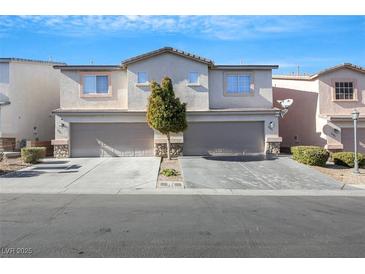 Two-story townhome with attached garage and landscaping at 2097 Audrey Hepburn St, Las Vegas, NV 89142