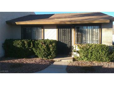 Front view of a single-story home with landscaped yard at 316 Linn Ln, Las Vegas, NV 89110