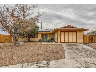 Charming single-story home with a gravel yard and an attached two-car garage at 4214 Bay Cir, Las Vegas, NV 89122
