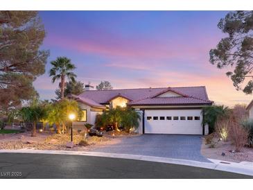 Stunning desert home with landscaped front yard, inviting entryway and two-car garage at 4920 Rancho Bernardo Way, Las Vegas, NV 89130