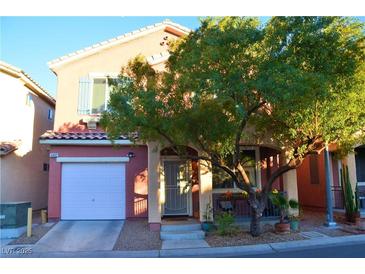 Two-story house with attached garage and landscaped front yard at 5402 Cross Meadows Ln, Las Vegas, NV 89122