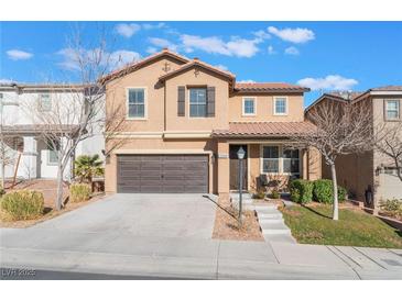 Two-story house with brown accents and a landscaped front yard at 10444 Britton Hill Ave, Las Vegas, NV 89129