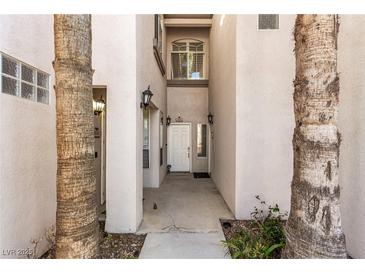 Inviting entryway with light-colored walls and a white door at 108 Breezy Tree Ct # 202, Las Vegas, NV 89145