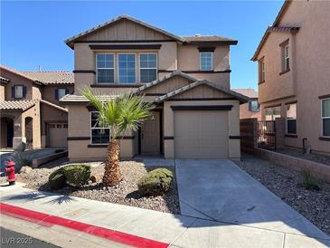 Two-story house with attached garage and desert landscaping at 1096 Country Coach Dr, Henderson, NV 89002