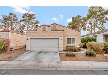 One-story house with attached garage and desert landscaping at 1619 Wendell Williams Ave, Las Vegas, NV 89106