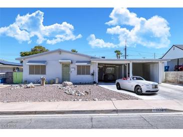 Ranch style home with carport and well-maintained landscaping at 1704 Hassett Ave, Las Vegas, NV 89104