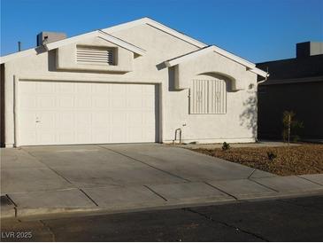 One-story house with attached two-car garage and desert landscaping at 3886 Via Lucia Dr, Las Vegas, NV 89115