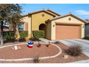 Front view of charming house with desert landscaping at 5550 Carrara Pointe St, Pahrump, NV 89061