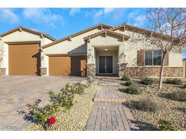 Single-story home with two-car garage and landscaped front yard at 6364 Cambridge Creek Ct, Las Vegas, NV 89149