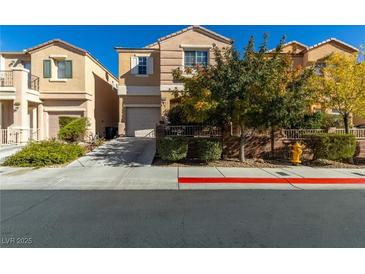 Two-story house with attached garage and small front yard at 6382 Lonesome Lake St, Las Vegas, NV 89148