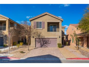 Two-story house with attached garage and landscaped front yard at 8284 Arden Ladder Pl, Las Vegas, NV 89117