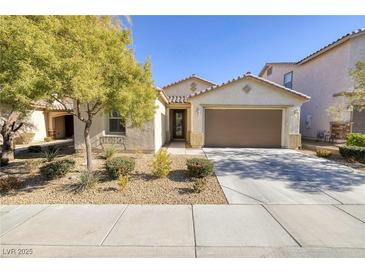 Single-story house with brown garage door and well-maintained landscaping at 844 Via Serenelia, Henderson, NV 89011