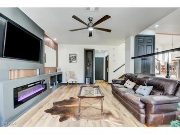 Spacious living room featuring a fireplace and modern decor at 1717 Imperial Cup Dr, Las Vegas, NV 89117