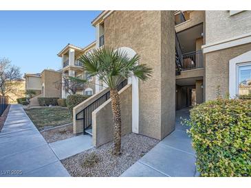 Tan two-story building with stairs and walkway at 2900 Sunridge Heights Pkwy # 1514, Henderson, NV 89052