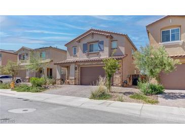 Two-story home with attached garage and landscaped front yard at 4138 Bayley Skye Ave, Las Vegas, NV 89141